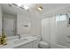 Well-lit bathroom with white vanity and shower featuring a shower curtain at 100 Maywood Way, Chapel Hill, NC 27516
