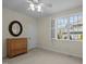Bedroom showcasing a window, dresser, and neutral carpet at 100 Maywood Way, Chapel Hill, NC 27516