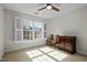 Bright bedroom with large window, shutter blinds, and classic wood furniture at 100 Maywood Way, Chapel Hill, NC 27516