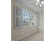 Bedroom featuring a window with white shutters and views of the outdoors at 100 Maywood Way, Chapel Hill, NC 27516