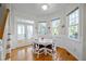 Charming dining area with hardwood floors, wainscoting and abundant natural light at 100 Maywood Way, Chapel Hill, NC 27516