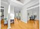 Open foyer with hardwood floors leading to a living room, dining area, and office at 100 Maywood Way, Chapel Hill, NC 27516