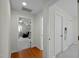 Hallway featuring wood floors and doorway to living area at 100 Maywood Way, Chapel Hill, NC 27516