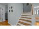 Bright stairway features hardwood treads, white risers, and a painted handrail at 100 Maywood Way, Chapel Hill, NC 27516