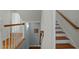 Staircase with wooden handrail, hardwood stairs, and walls adorned with art at 100 Maywood Way, Chapel Hill, NC 27516