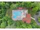 Stunning aerial view of a community pool with ample lounge chairs surrounded by lush greenery at 1014 Laurens Way, Knightdale, NC 27545