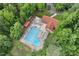 Aerial view of the community pool area surrounded by green trees at 1014 Laurens Way, Knightdale, NC 27545