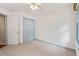 Bright bedroom featuring plush carpet, a ceiling fan and closet at 1014 Laurens Way, Knightdale, NC 27545