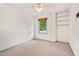 Bedroom featuring neutral carpet, built in shelving, ceiling fan, and serene views at 1014 Laurens Way, Knightdale, NC 27545