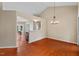 Open-concept dining area with hardwood floors connecting to the kitchen at 1014 Laurens Way, Knightdale, NC 27545