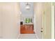 Inviting entryway featuring a view into the living room with hardwood floors and fireplace at 1014 Laurens Way, Knightdale, NC 27545
