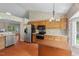 Spacious kitchen with stainless steel appliances, light wood cabinetry, and an eat-in area at 1014 Laurens Way, Knightdale, NC 27545