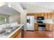 Open kitchen featuring stainless steel appliances, light countertops, and an eat-in area at 1014 Laurens Way, Knightdale, NC 27545