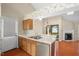 Cozy kitchen featuring stainless steel appliances and open layout to the living spaces at 1014 Laurens Way, Knightdale, NC 27545