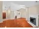 Spacious living room with hardwood floors, fireplace, skylight, and an open floor plan at 1014 Laurens Way, Knightdale, NC 27545