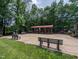 Picturesque picnic area featuring covered tables, benches, and a stone fireplace at 1014 Laurens Way, Knightdale, NC 27545