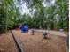 Well-equipped community playground with various play structures and fitness equipment at 1014 Laurens Way, Knightdale, NC 27545