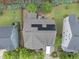 Aerial view of a house with solar panels on the roof and a moving truck in the driveway at 1029 Dozier Way, Cary, NC 27518