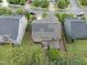 Aerial view of a house with solar panels on the roof and a patio at 1029 Dozier Way, Cary, NC 27518