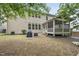 Spacious backyard with a patio and a screened porch, perfect for outdoor living at 1029 Dozier Way, Cary, NC 27518