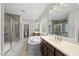 Bright bathroom with large soaking tub, glass shower, dual sink vanity, and tile floors at 1029 Dozier Way, Cary, NC 27518