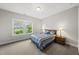 Comfortable bedroom with carpet, neutral walls, and ample natural light from the window at 1029 Dozier Way, Cary, NC 27518