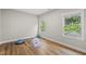 Bedroom featuring wood floors, natural light, and neutral wall colors at 1029 Dozier Way, Cary, NC 27518
