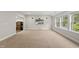Large bonus room with neutral carpet, multiple windows and a wall mounted television at 1029 Dozier Way, Cary, NC 27518