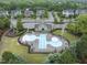 Aerial view of a community pool with a building, playground, and parking at 1029 Dozier Way, Cary, NC 27518