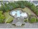 Aerial view of a community pool with a building, playground, and parking at 1029 Dozier Way, Cary, NC 27518