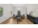 Formal dining room with wainscoting, hardwood floors, and chandelier lighting at 1029 Dozier Way, Cary, NC 27518
