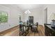 Formal dining room with wainscoting, hardwood floors, and chandelier lighting at 1029 Dozier Way, Cary, NC 27518