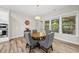 Dining room with a wood table, gray chairs and plenty of natural light from the windows at 1029 Dozier Way, Cary, NC 27518
