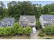 Charming two-story home with trees and a driveway featuring a white trailer for moving at 1029 Dozier Way, Cary, NC 27518