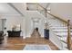 Open foyer with hardwood floors, staircase, and decor leading to other rooms at 1029 Dozier Way, Cary, NC 27518