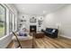 Cozy living room with fireplace, large windows, and comfortable seating at 1029 Dozier Way, Cary, NC 27518
