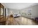 Bright main bedroom featuring hardwood floors, natural light, and neutral wall colors at 1029 Dozier Way, Cary, NC 27518