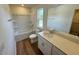 Bathroom featuring a shower, toilet, and sink with modern fixtures and a white cabinet at 10517 Brookside Reserve Rd, Raleigh, NC 27614