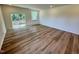 Spacious living room with wood floors and ample natural light at 10517 Brookside Reserve Rd, Raleigh, NC 27614
