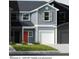 Exterior elevation of a two-story townhome featuring a red door and attached garage at 10564 Brookside Reserve St, Raleigh, NC 27614