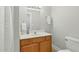 Bathroom features a wooden vanity, white counter tops and neutral colors at 106 Eagle Crest Ln, Princeton, NC 27569
