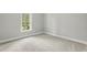 Bedroom featuring neutral carpeting and a window with backyard view at 106 Eagle Crest Ln, Princeton, NC 27569