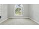 Bedroom featuring neutral carpet, a large window with natural light at 106 Eagle Crest Ln, Princeton, NC 27569