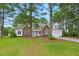 Charming brick and siding home with a welcoming front porch and well-manicured lawn at 106 Eagle Crest Ln, Princeton, NC 27569