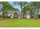 Charming brick and siding home with a welcoming front porch and well-manicured lawn at 106 Eagle Crest Ln, Princeton, NC 27569