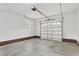 The garage features white walls, a brick foundation, and a single window at 106 Eagle Crest Ln, Princeton, NC 27569
