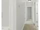 Hallway with carpet and multiple doors at 106 Eagle Crest Ln, Princeton, NC 27569