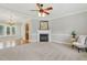 Cozy living room featuring a fireplace and a ceiling fan at 106 Eagle Crest Ln, Princeton, NC 27569