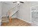 The living room has hardwood floors, a staircase, and a doorway to the garage at 106 Eagle Crest Ln, Princeton, NC 27569