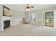 Cozy living room featuring a fireplace and a door to a garden at 106 Eagle Crest Ln, Princeton, NC 27569